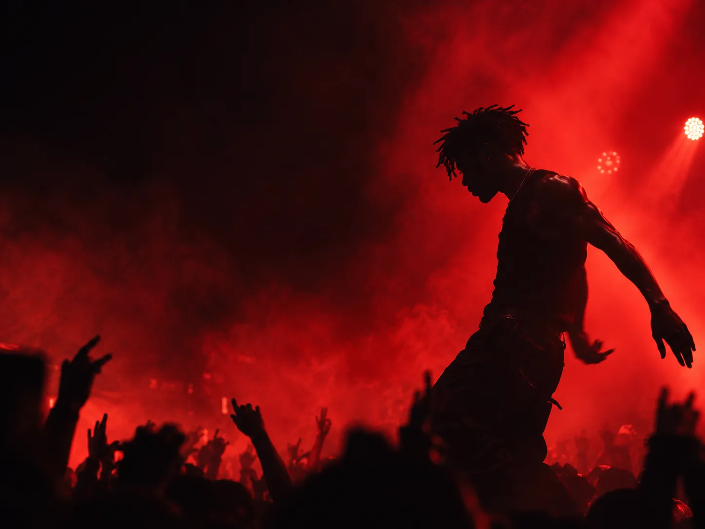 Red-lit silhouette in a cinematic music venue